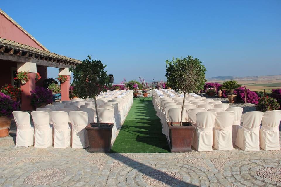 Outdoor ceremony set up on the terrace overlooking the countryside